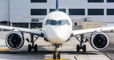a large jetliner sitting on top of an airport tarmac