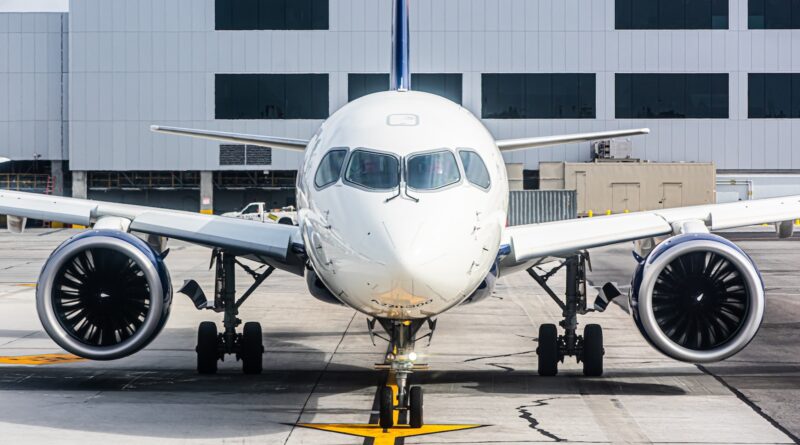 a large jetliner sitting on top of an airport tarmac