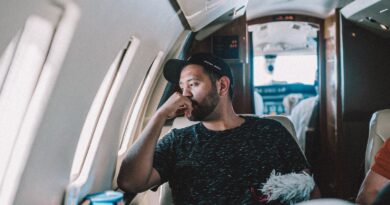 man sitting inside airplane