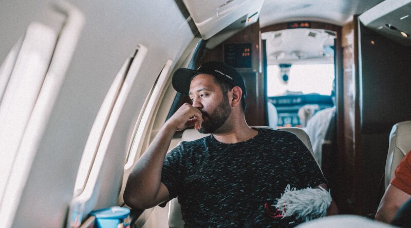man sitting inside airplane