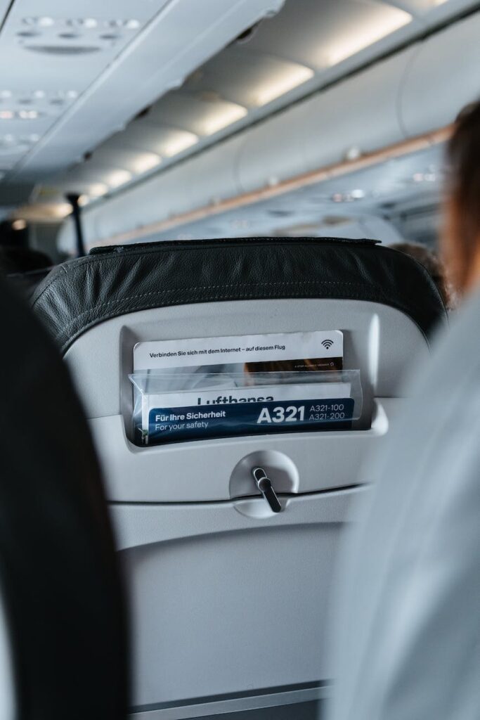 person sitting inside airliner seat