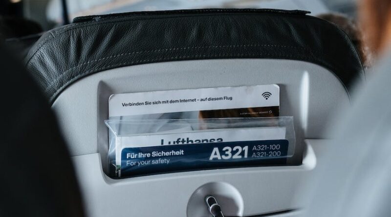 person sitting inside airliner seat