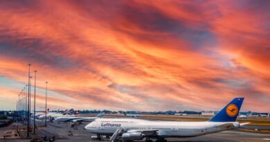 an airplane in the runway during golden hour