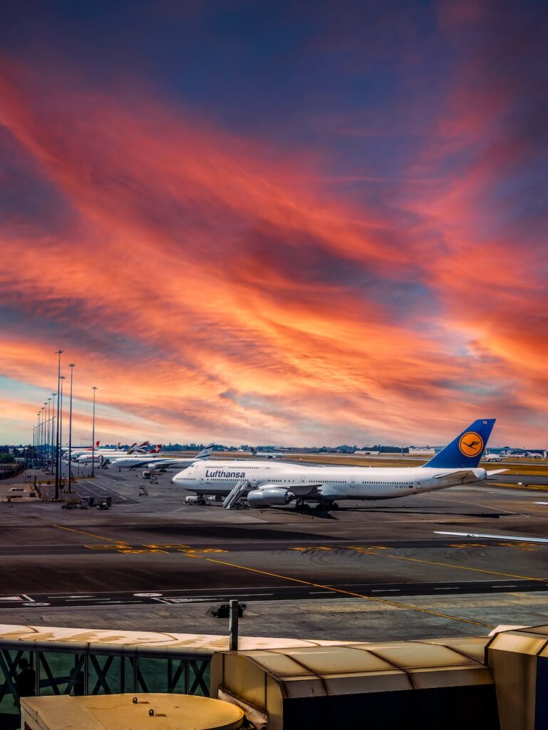 an airplane in the runway during golden hour