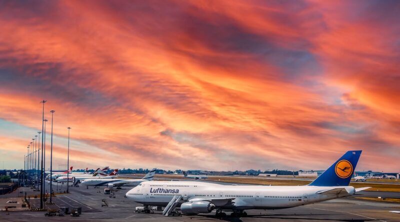 an airplane in the runway during golden hour