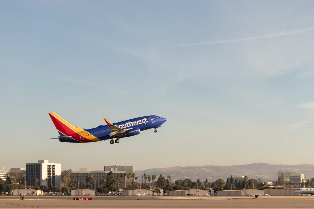 a large jetliner flying through a blue sky
