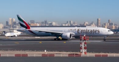 white and red airplane on airport during daytime