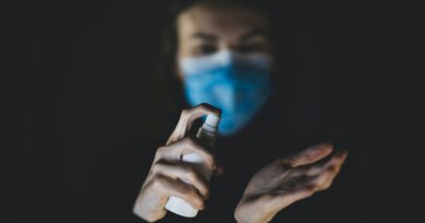 person holding black and white device