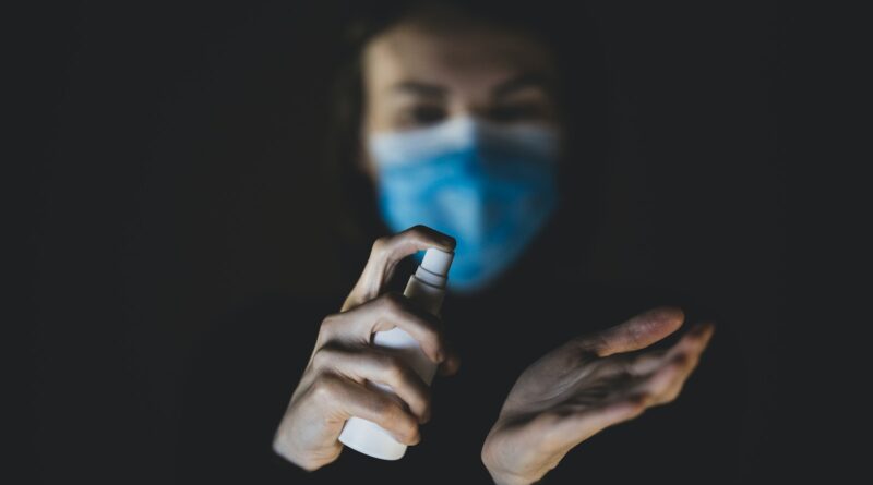 person holding black and white device
