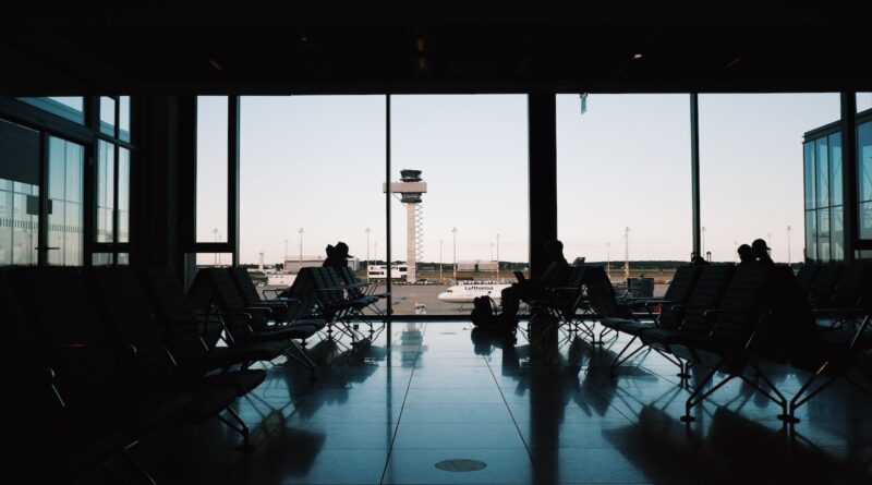 a group of people sitting in a waiting area