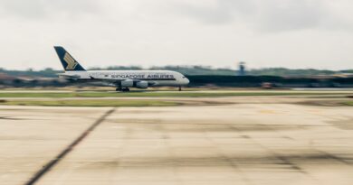 airplane on gray concrete road