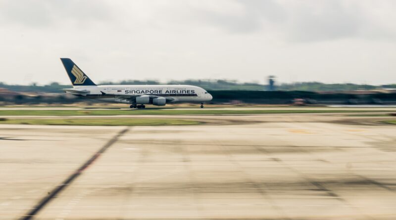 airplane on gray concrete road